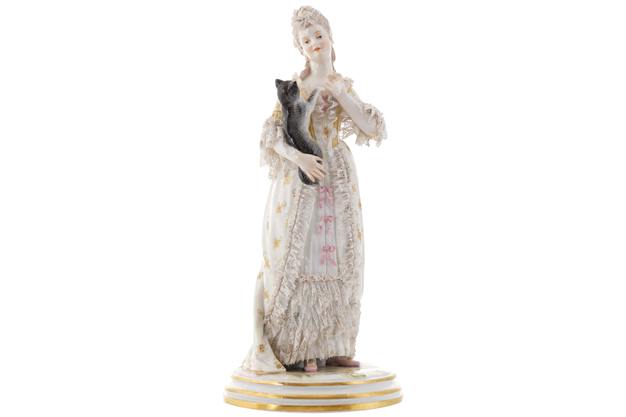 NINETEENTH-CENTURY MEISSEN FIGURE HOLDING A CAT21 cm. high