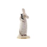 NINETEENTH-CENTURY MEISSEN FIGURE HOLDING A CAT21 cm. high