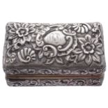 CASED SILVER CURLING TONG HEATERof rectangular form with all over embossed floral and C scroll