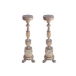 PAIR OF SEVENTEENTH-CENTURY BAROQUE PARCEL GILT CANDLESTICKSeach with an anthemion leaf carved stem,