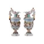 PAIR OF NINETEENTH-CENTURY CAPODIMONTE EWERSeach with raised cherub and seahorse decoration38 cm.