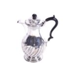 SILVER HOT WATER JUGof baluster form with gadrooned body and C-scroll handle. Birmingham,