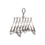 UNUSUAL HUNTING THEMED TOAST RACKin the form of arrows forming a triumphant arch, with deer