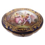 SERVES PORCELAIN AND ORMOLU JEWELLERY CASKET of oval serpentine form, the lid depicting a young
