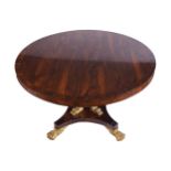 WILLIAM IV ROSEWOOD AND PARCEL GILT CENTRE TABLE, CIRCA 1830the circular shaped top, above a