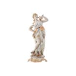 GERMAN PORCELAIN POLYCHROME FIGURE OF A NYMPHwith a dove on her shoulderProvenance: The Estate of