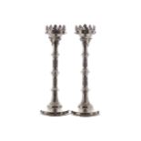 PAIR OF NINETEENTH-CENTURY GOTHIC SILVER PLATED CANDLESTICKS48 cm. high; 16 cm. diameter (2)