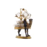 NINETEENTH-CENTURY ORMOLU AND GILT METAL LIQUEUR STANDin the form of a camel, supporting two glasses