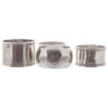 TWO SILVER BIRMINGHAM NAPKIN RINGStogether with a plated napkin ring inscribed “Beamish” and an