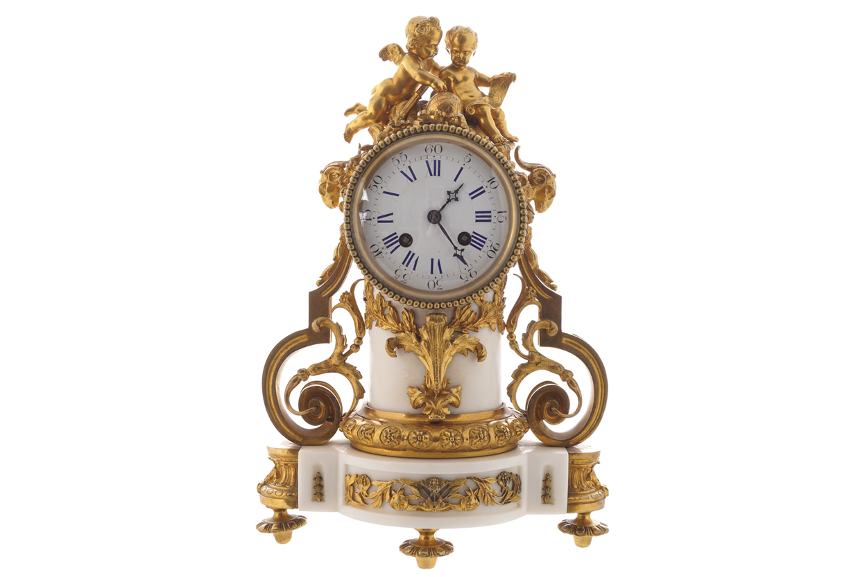 MID-NINETEENTH-CENTURY FRENCH GILT BRONZE AND WHITE MARBLE MANTEL CLOCK the central pillar flanked