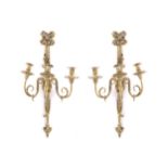 PAIR OF ORMOLU WALL LIGHTSeach of two scroll arms suspended on ribbons69 cm. high; 35 cm. wide (2)