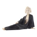 JAPANESE MEIJI PERIOD BRONZE AND IVORY RECLINING GEISHA GIRL17 cm. high; 24 cm. long