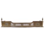 EDWARDIAN BRASS NEO-CLASSICAL FIRE FENDER the pierced breakfront flanked by paterae panels