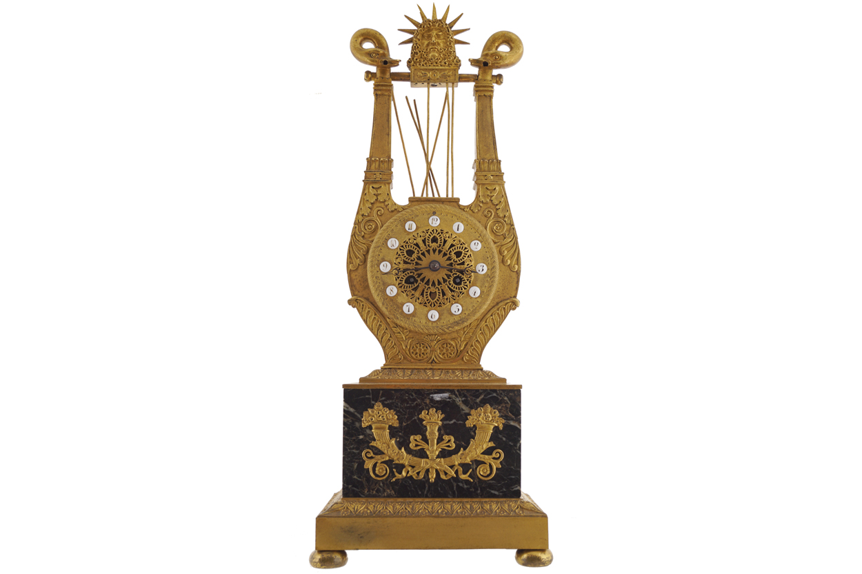 FRENCH EMPIRE PERIOD ORMOLU AND MARBLE MOUNTED CLOCK of lyre form, circa 1820 48 cm. high