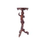 NINETEENTH-CENTURY VENETIAN NUBIAN CHERUB STEMMED TORCHERE raised on a scroll legged pod 78 cm.