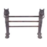 REGENCY CAST IRON FIRE FRONT formed with two lion mask monopods, joined by cross bars 54 cm. high;