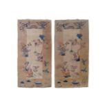 TWO CHINESE RUGS on cream ground with multi-coloured floral decoration, and a mushroom border with
