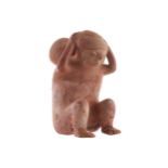 POTTERY SCULPTURE (DAMAGED) Possibly Pre-Colombian of a seated figure, his hands clasping his head