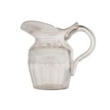 EARLY WATERFORD CUT GLASS JUG (DAMAGED) with scroll handle and hob nail decoration Provenance: The