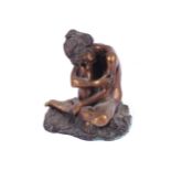 TWENTIETH-CENTURY SCULPTURE OF A YOUNG GIRL seated on a rock 25 cm. high