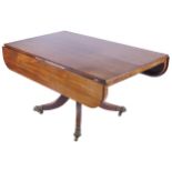 REGENCY PERIOD MAHOGANY LIBRARY TABLE the square top, with D-shaped drop leaves, raised on a