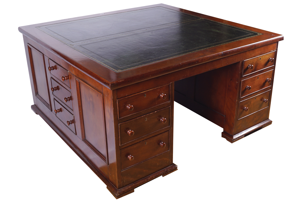 NINETEENTH CENTURY MAHOGANY PARTNER’S DESK the expansive square leather inset top above a series