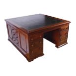 NINETEENTH CENTURY MAHOGANY PARTNER’S DESK the expansive square leather inset top above a series