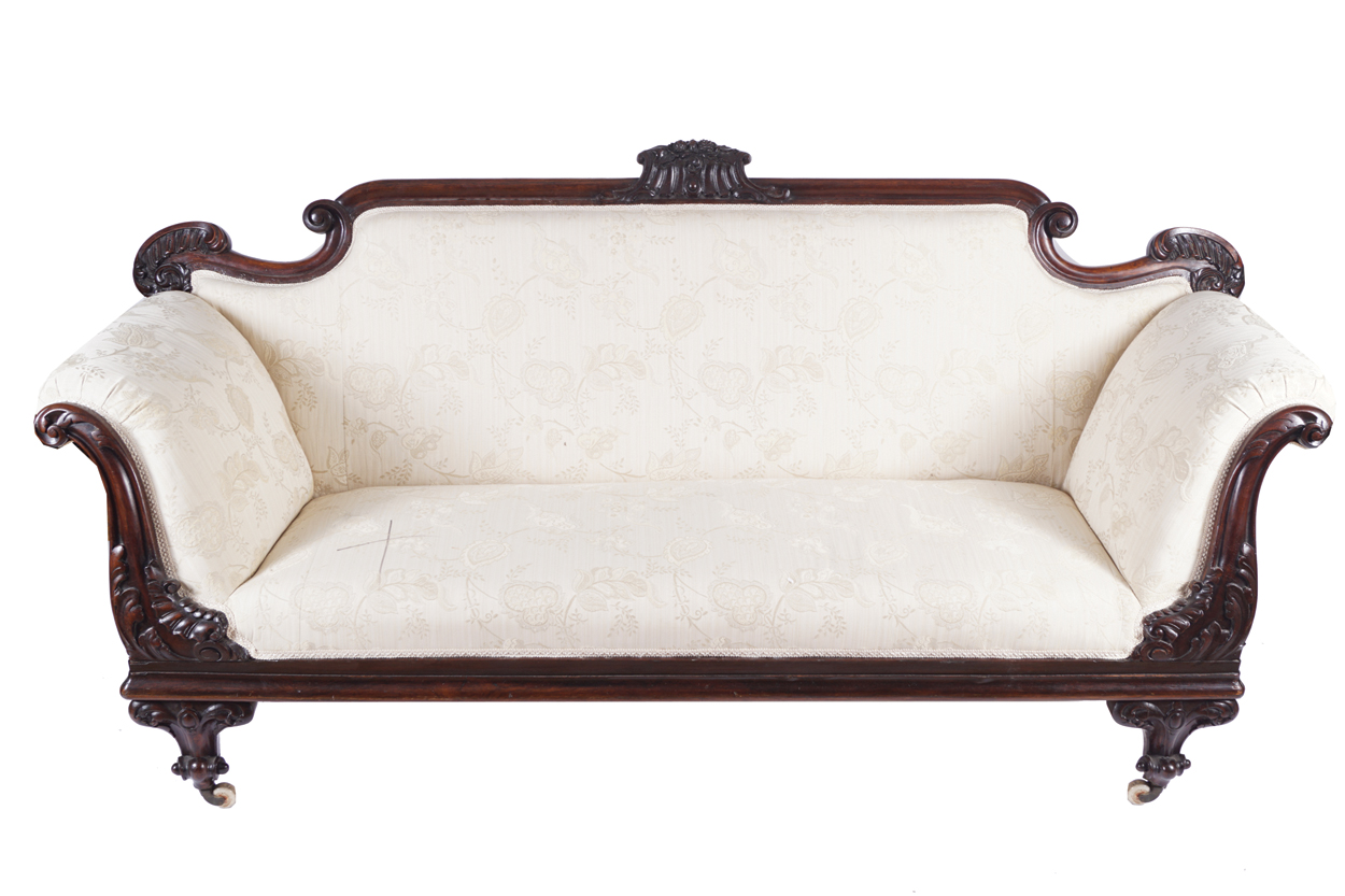 NINETEENTH-CENTURY MAHOGANY AND UPHOLSTERED LIBRARY SETTEE with carved scroll fronted ends, raised