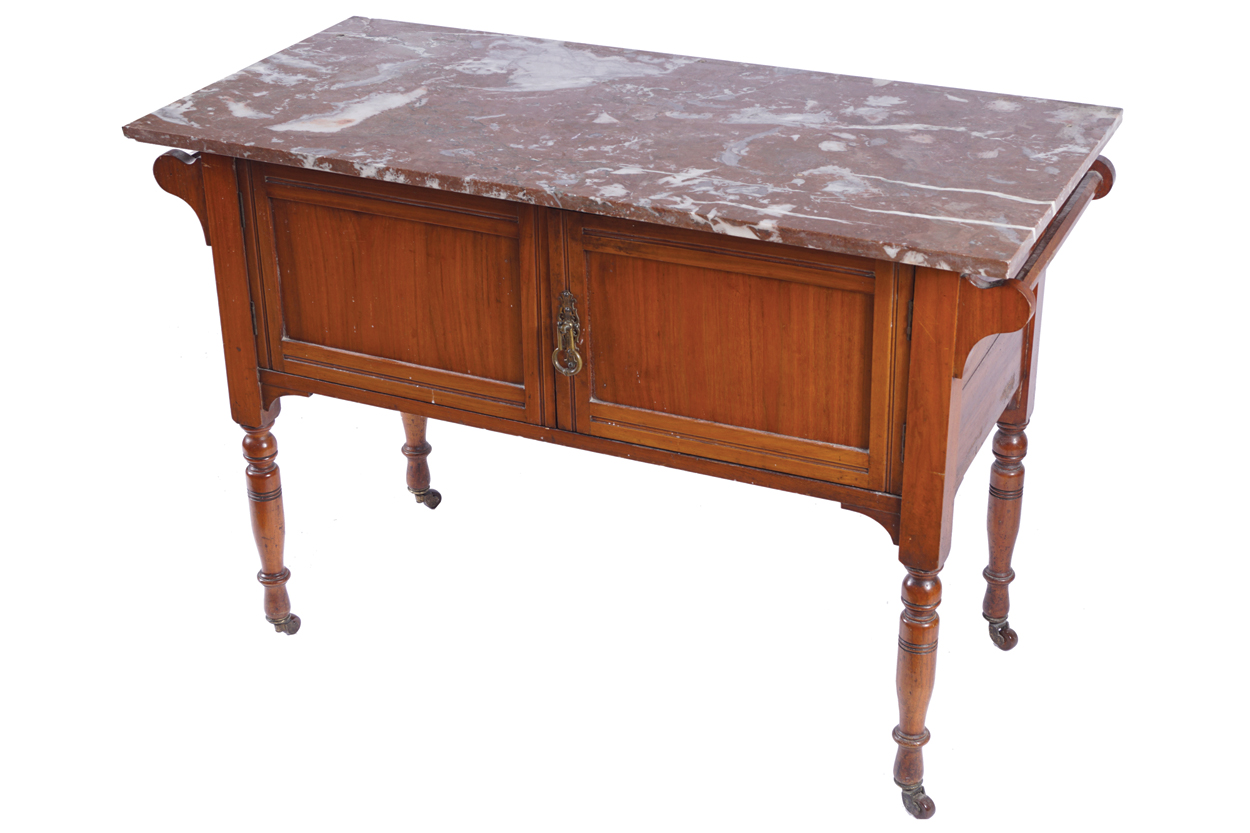 EDWARDIAN WALNUT WASH STAND the rectangular marble top, above two panelled doors, raised on turned