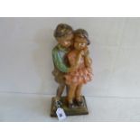 Painted plaster figure of Boy & Girl c.