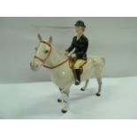 Beswick huntswoman on dappled grey horse