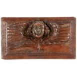 HOLZRELIEF MIT PUTTENKOPF 17./18.Jh. Geschnitztes Hartholz. 37x21cm A WOOD RELIEF WITH HEAD OF A