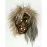 HEXENMASKE wohl Schweiz, 20.Jh. Holz, geschnitzt mit Haaren. H.16cm A WITCH MASK probably