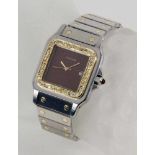 CARTIER SANTOS DAMEN/HERRENARMBANDUHR Edelstahl und 750/000 Gold mit diamantbesetzter Lunette.