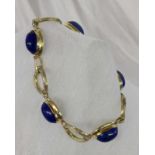 ARMBAND 585/000 Gelbgold mit Lapislazuli-Cabochons. L.17cm, brutto ca. 22,7g A BRACELET 585/000