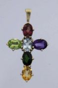 KREUZANHÄNGER 585/000 Gelbgold mit verschiedenen Edelsteinen. Brutto ca. 3g, L.3,5cm A CROSS PENDANT