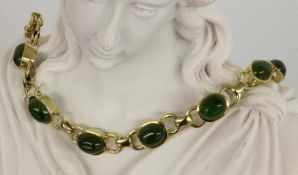 ARMBAND 585/000 Gelbgold mit Jade-Cabochons. Brutto ca. 22,7g, L.18cm A BRACELET 585/000 yellow gold