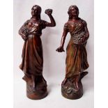 A pair of bronze patinated French 19th century spelter Figures as flower sellers, 29cm high