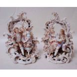 A pair of 19th century decorated porcelain Figural Groups, (possibly Sitzendorf), each depicting a