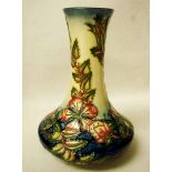 A Moorcroft Pottery Vase, tubeline decorated in the Sweet Briar design by Rachel Bishop, impressed