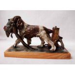An Austrian cold painted Strike-Lite spelter Table Lighter modelled as a spaniel retrieving a cock