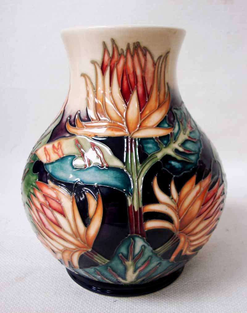 A Moorcroft Pottery Baluster Vase, tubeline decorated in the Burdock design by Philip Gibson,