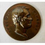 A large bronze Medallion, commemorating Abraham Lincoln, raised head and Abraham Lincoln to obverse,