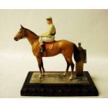 An early 20th century cold painted spelter model of a Horse and Jockey as a Table Lighter, with