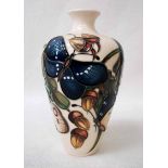 A Moorcroft pottery Vase of tapering narrow neck form, decorated with acorns and butterflies,