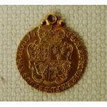 A George III Gold Half Guinea, 1764 with soldered gold pendant loop, 4.5g