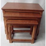 Robert 'Mouseman' Thompson of Kilburn, a nest of three oak Occasional Tables, rectangular tops