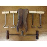 An early 20th century mahogany portable boot jack of hinged folding form with brass furniture,