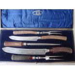 Edwardian six piece cased double Carving Set, by Joseph Rodgers and Sons, antler handles in fitted