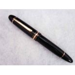 A Mont Blanc Meisterstuck Fountain Pen, model number 149, black case with gilt metal fittings and